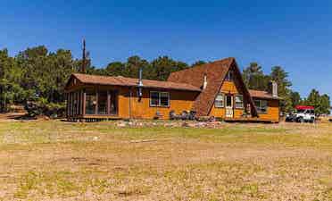 Rural home between forested hills