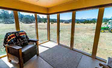 Rural home between forested hills
