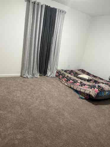 A bedroom with loft upstairs