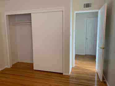 bedroom with shared bathroom