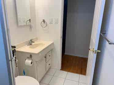 bedroom with shared bathroom