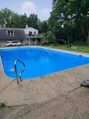 Large room in a home with pool