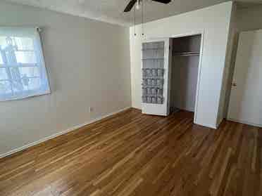 Bedroom open in cozy, artsy home