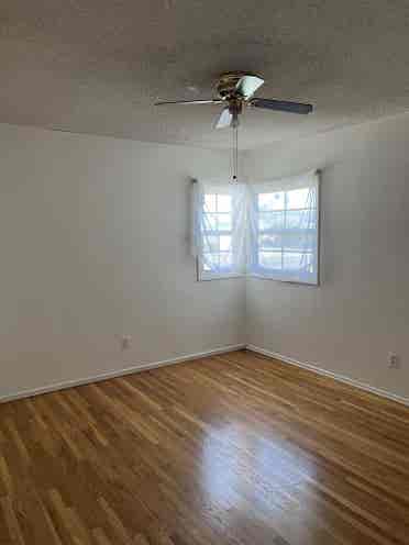 Bedroom open in cozy, artsy home