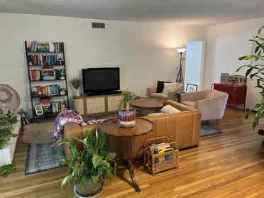 Bedroom open in cozy, artsy home