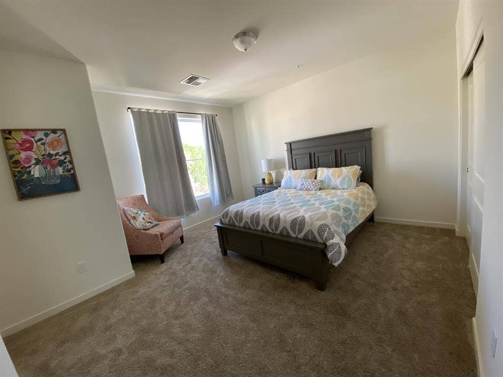 Furnished bedroom en suite bathroom