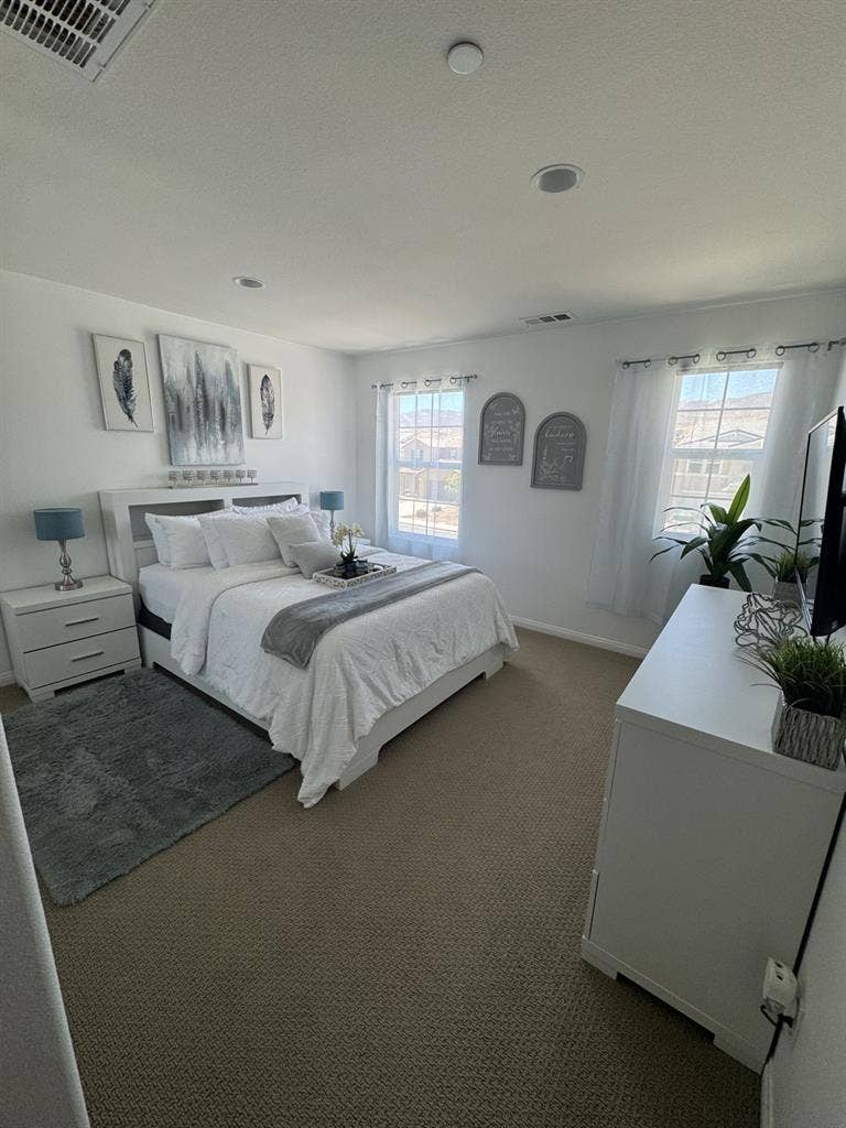 Bedroom and full bathroom with tub