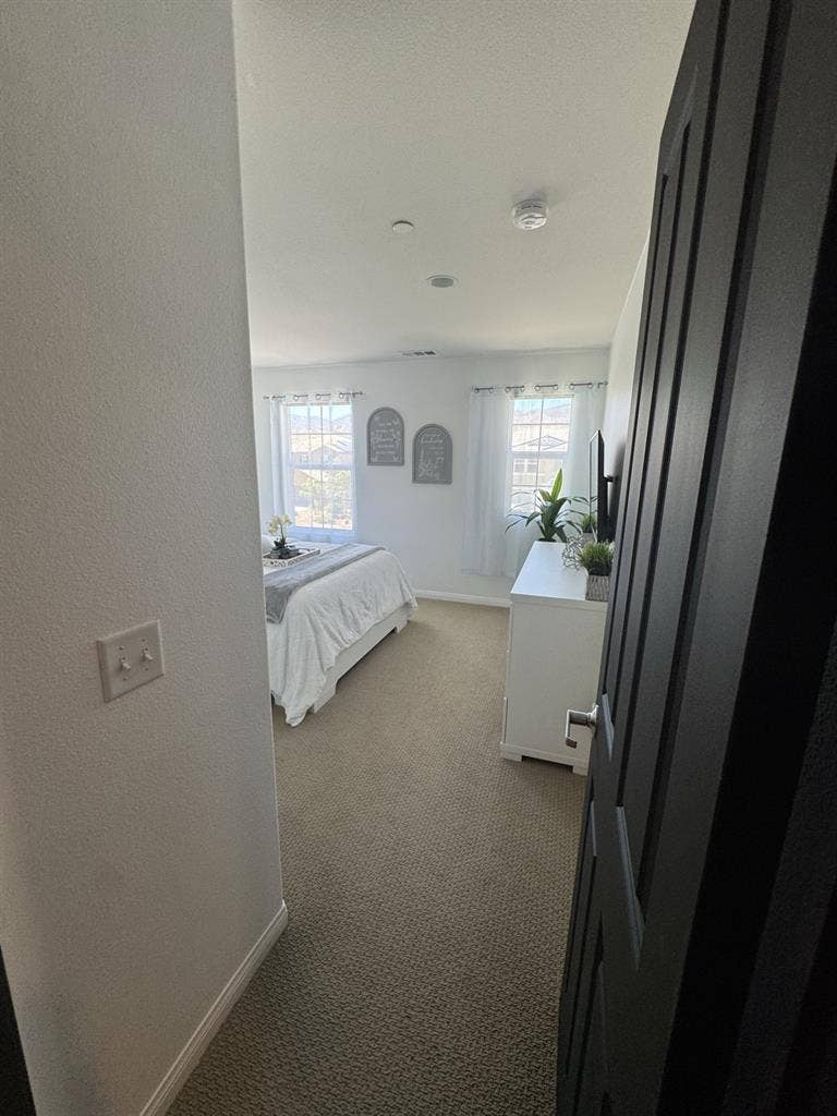 Bedroom and full bathroom with tub