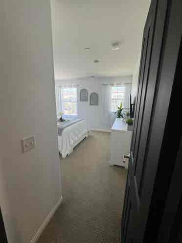 Bedroom and full bathroom with tub