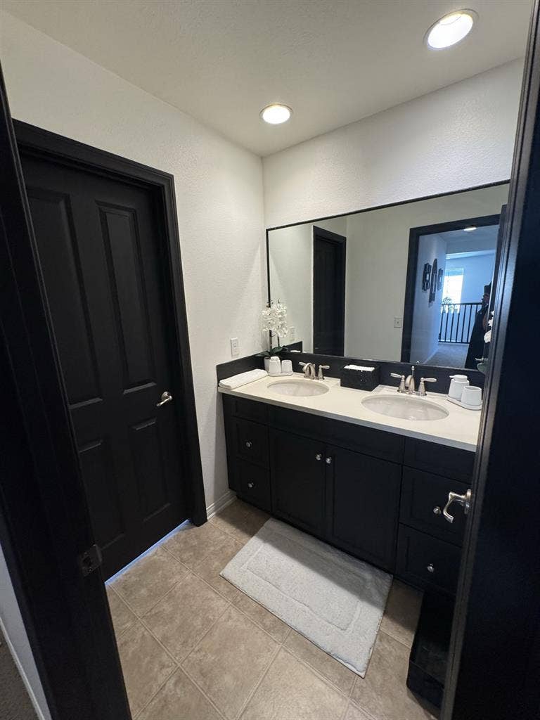 Bedroom and full bathroom with tub