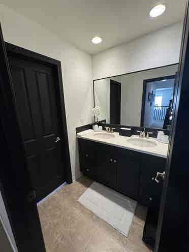 Bedroom and full bathroom with tub