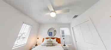 A room, bathroom and a parking spot