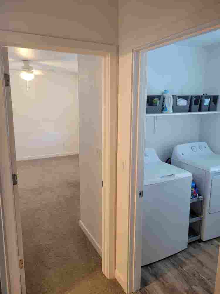 A room, bathroom and a parking spot