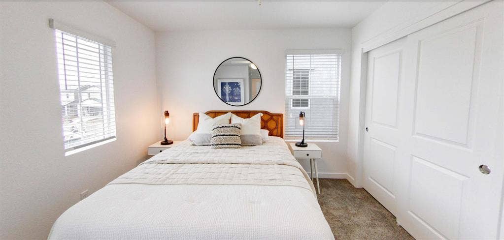 A room, bathroom and a parking spot