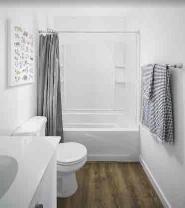 A room, bathroom and a parking spot