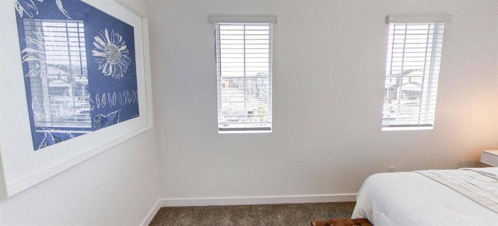 A room, bathroom and a parking spot