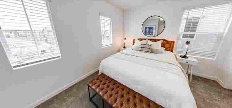 A room, bathroom and a parking spot