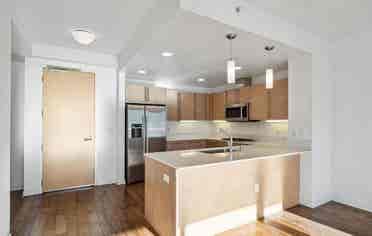 Bright 1BR + Den with City Views