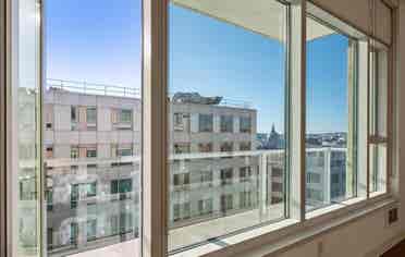 Bright 1BR + Den with City Views