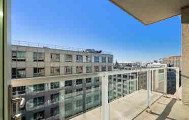 Bright 1BR + Den with City Views