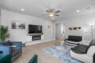 A furnished room with shared spaces