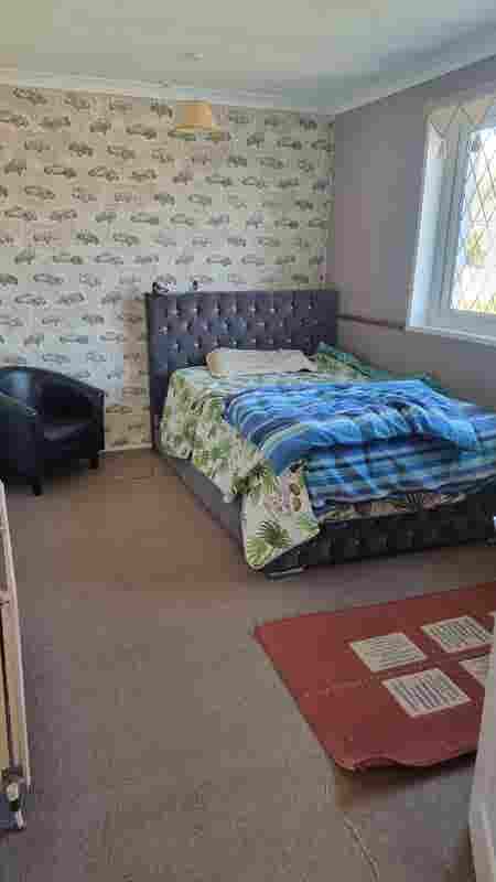 Furnished Room with TV, Table & Bed
