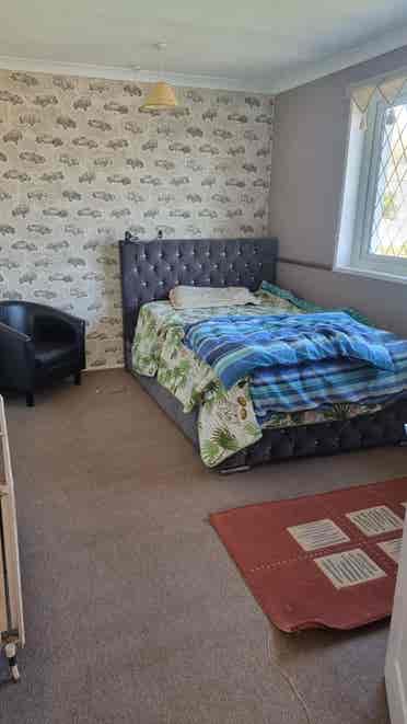Furnished Room with TV, Table & Bed