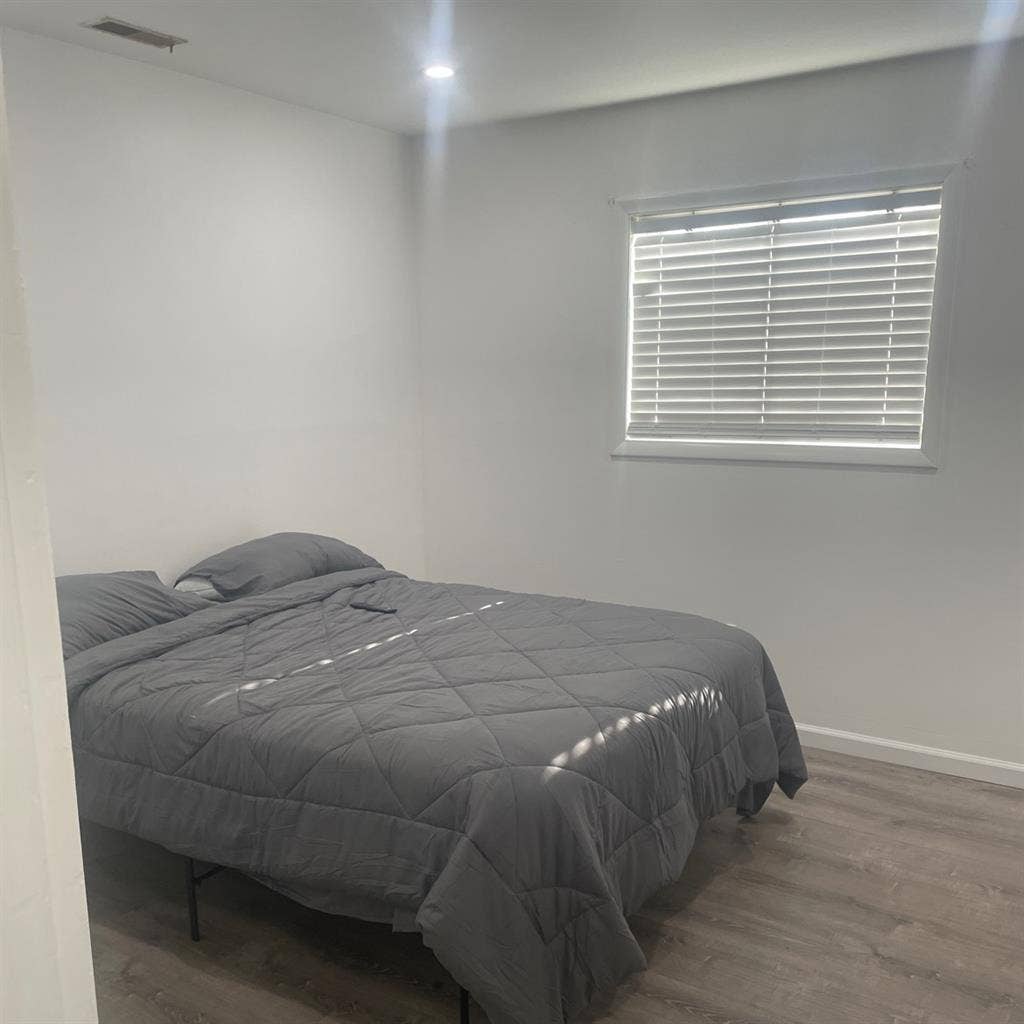 Large room with queen size bed.