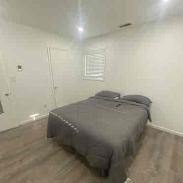 Large room with queen size bed.