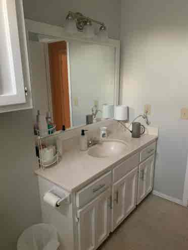 Furnished bedroom w/ private bath
