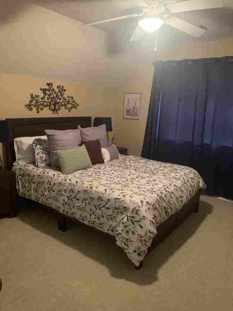 Furnished bedroom w/ private bath