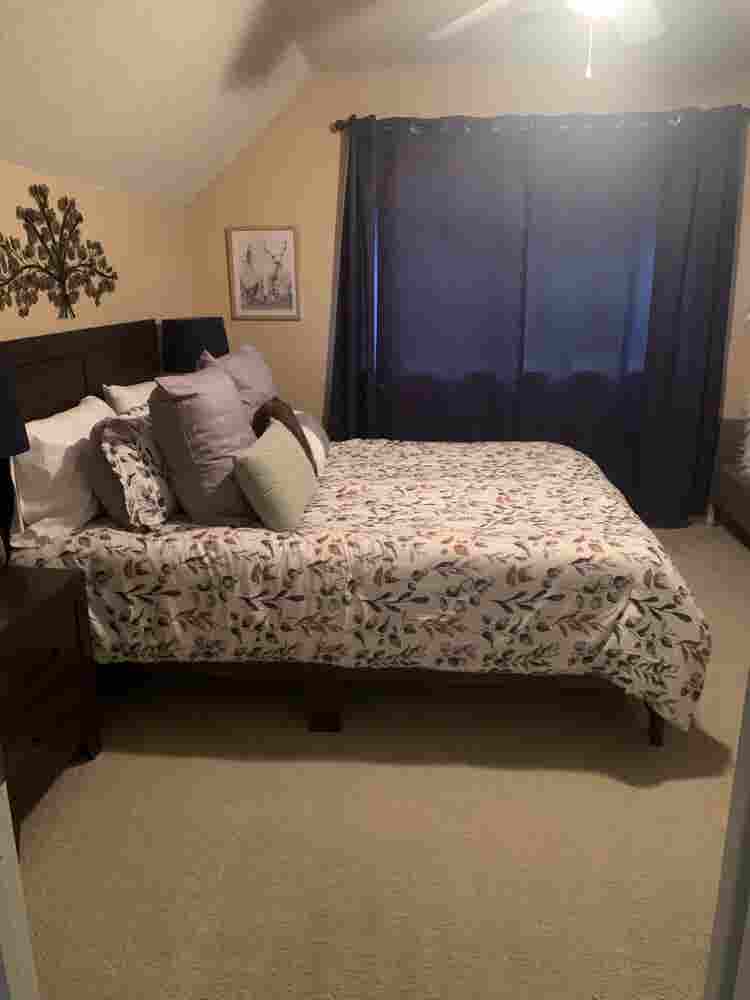 Furnished bedroom w/ private bath