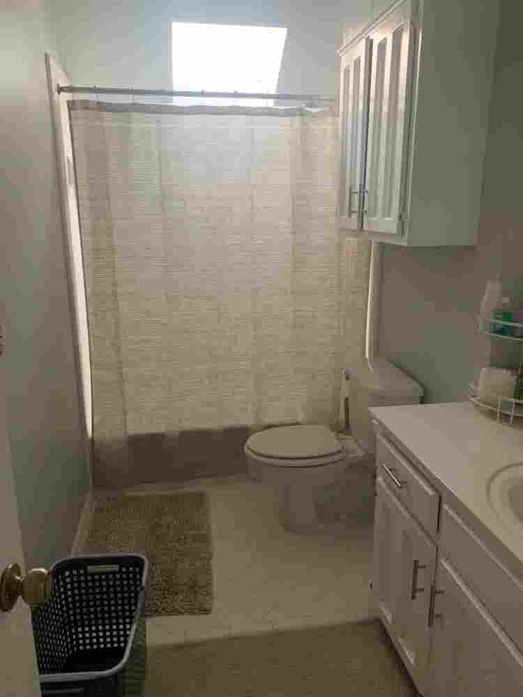 Furnished bedroom w/ private bath