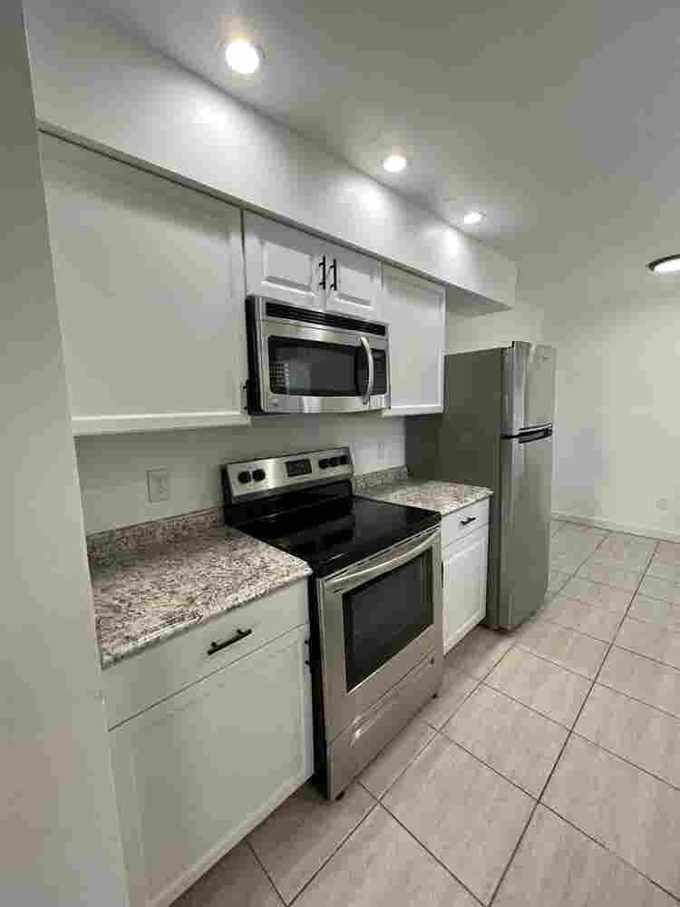 Room with shared bath with utilties