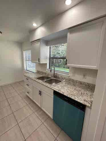 Room with shared bath with utilties