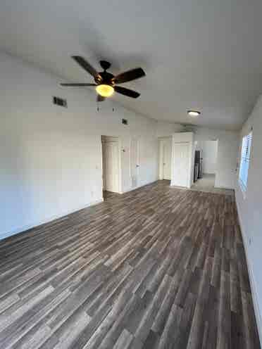 Room with shared bath with utilties