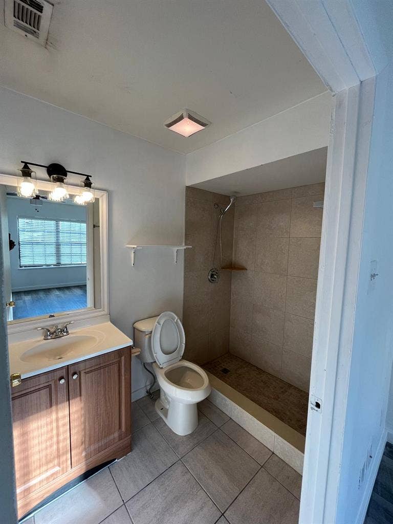 Room with shared bath with utilties