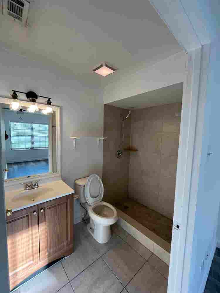 Room with shared bath with utilties