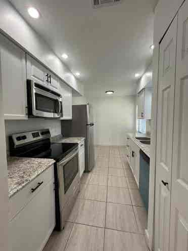 Room with shared bath with utilties