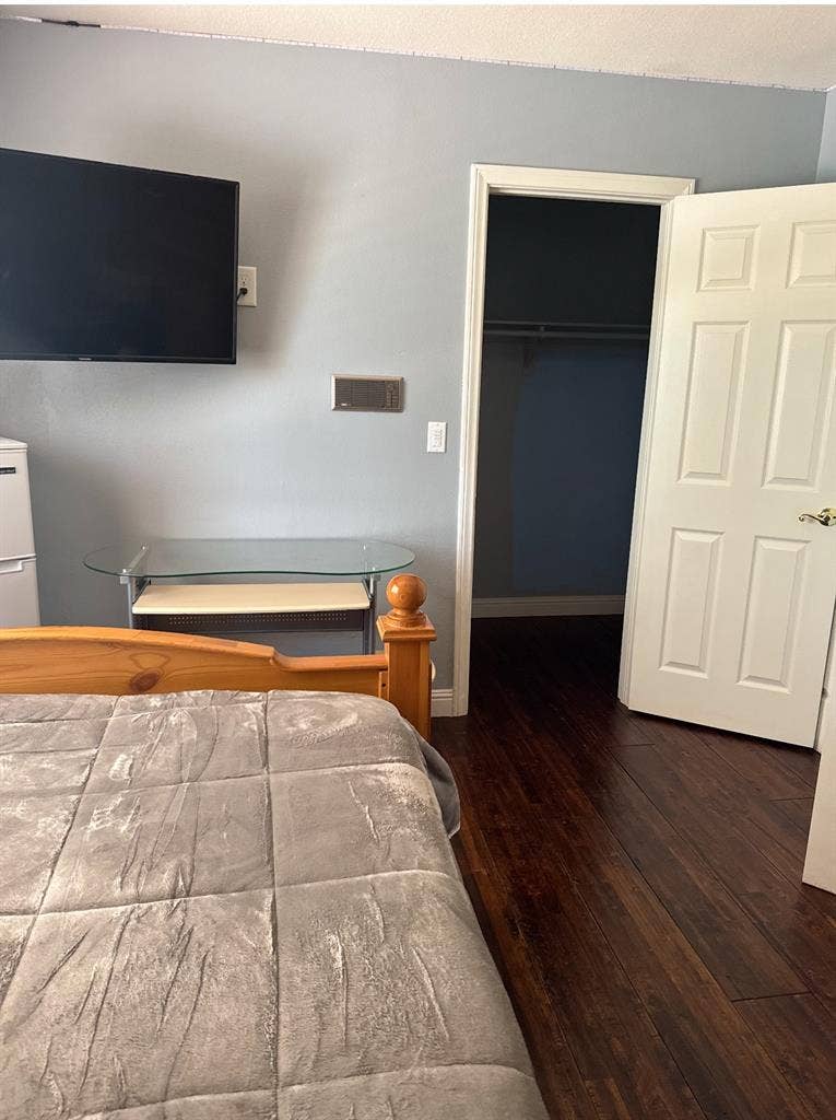 Furnished room with walking closet