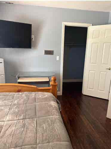 Furnished room with walking closet