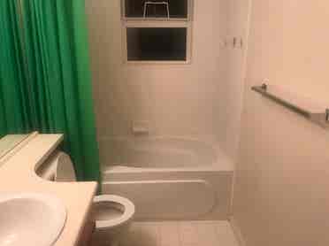 A furnished room with private bath