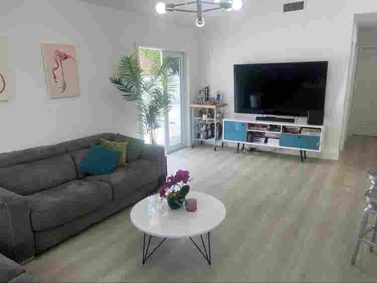 furnished room with shared bathroom