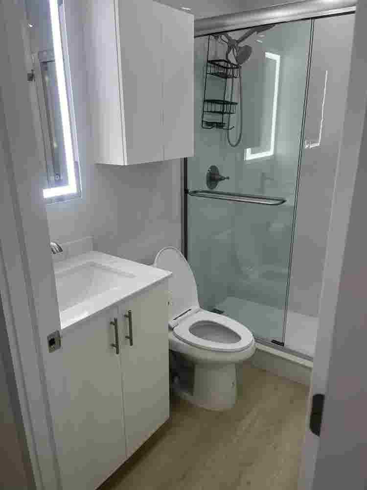 furnished room with shared bathroom