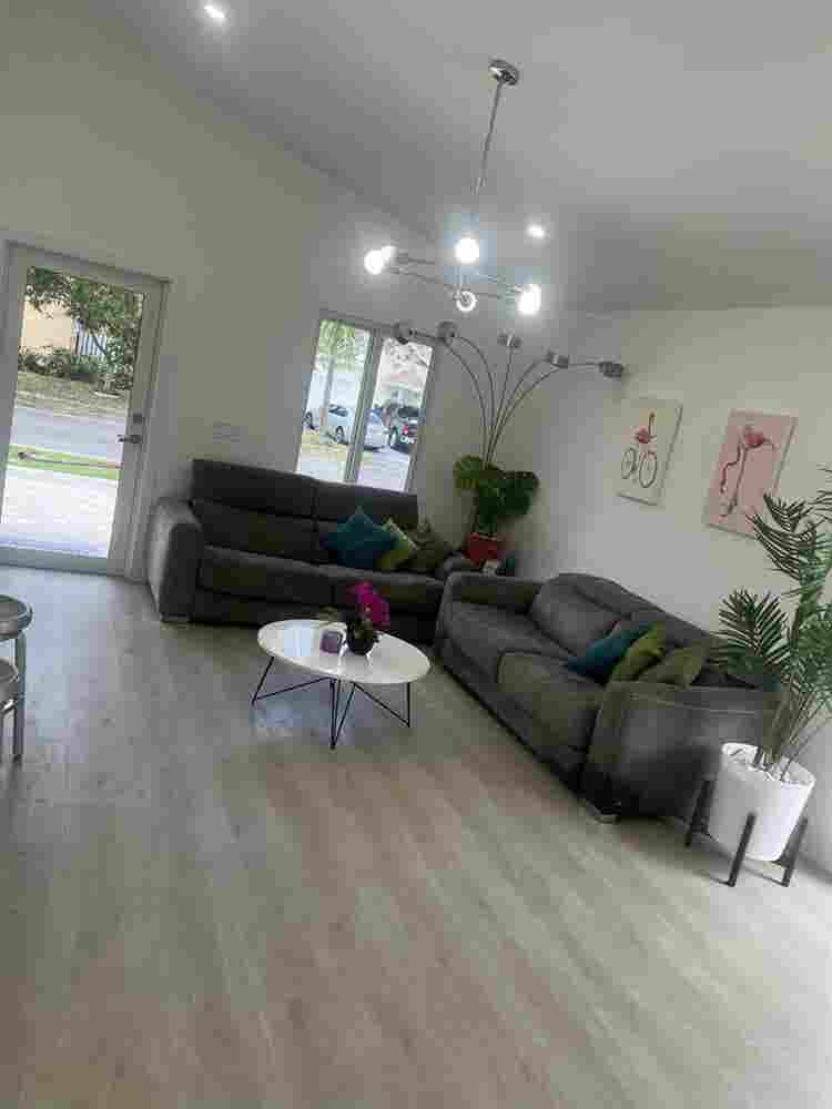 furnished room with shared bathroom