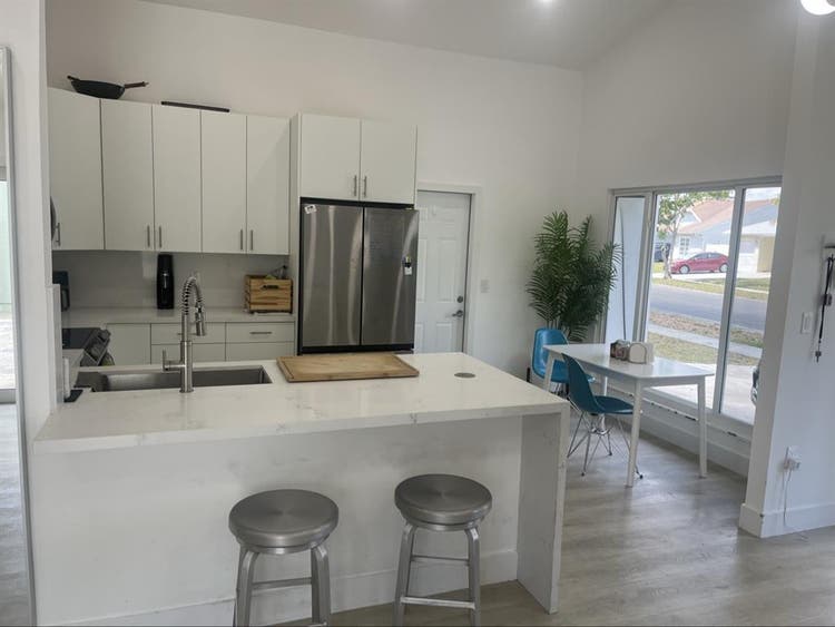 furnished room with shared bathroom