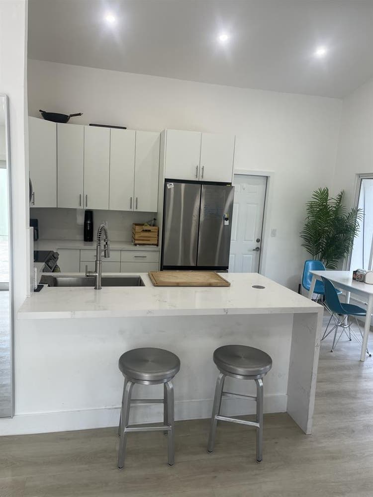 furnished room with shared bathroom