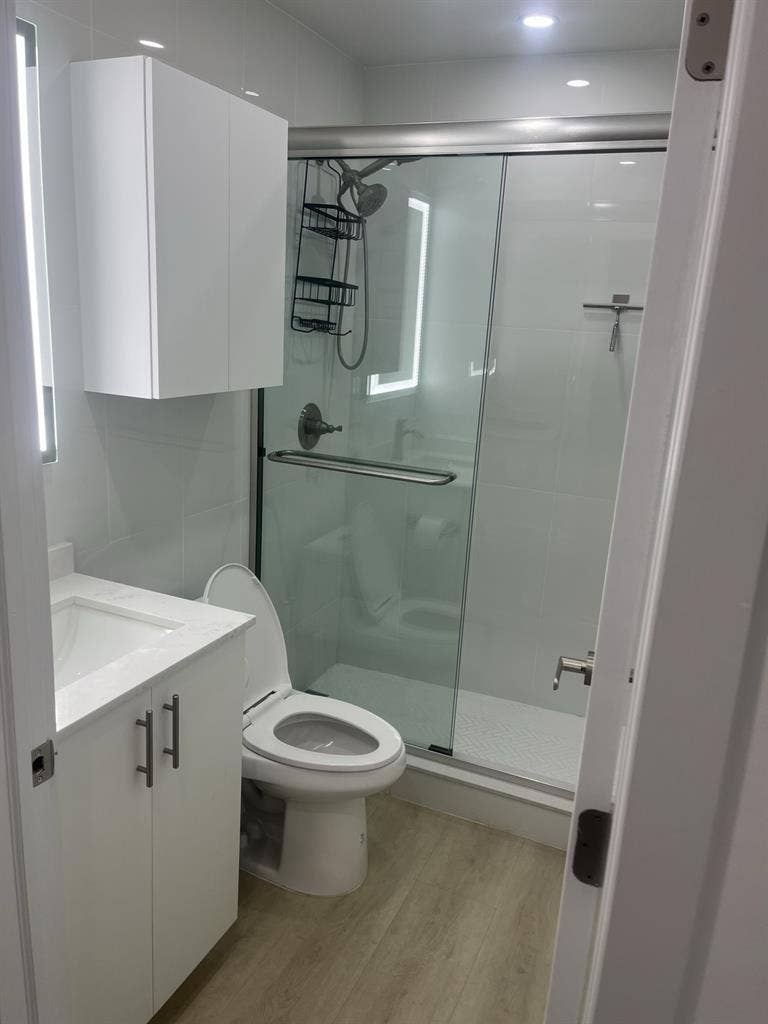 furnished room with shared bathroom
