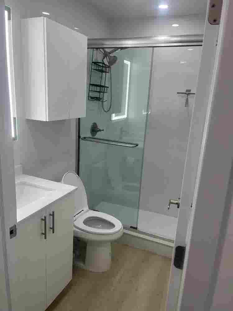 furnished room with shared bathroom