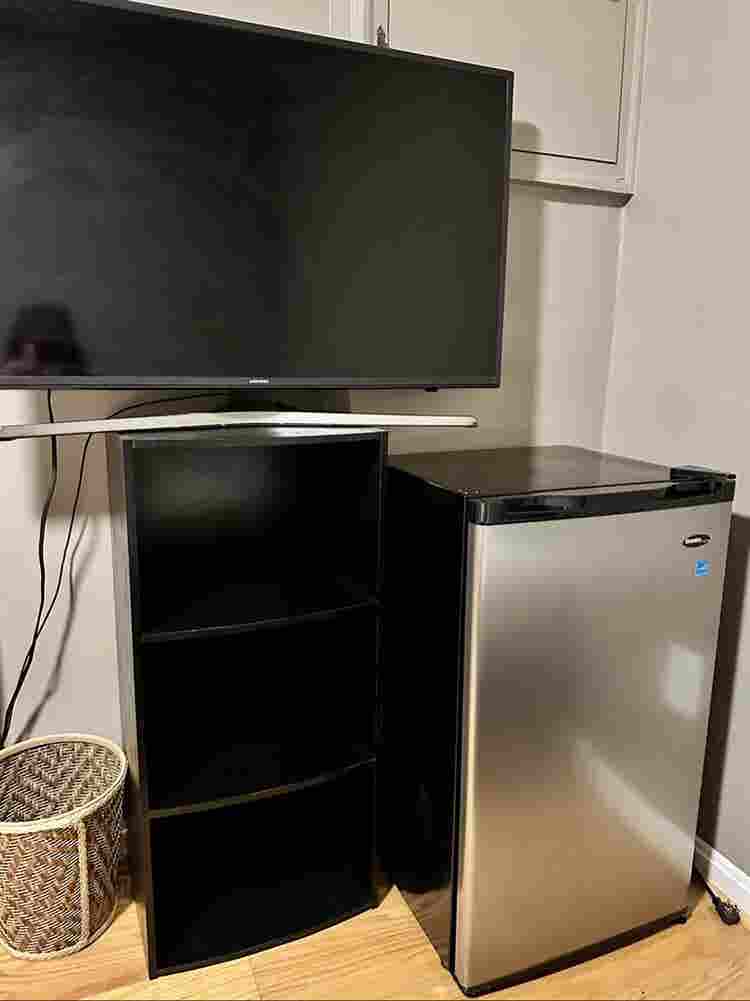 A basement level furnished bedroom.